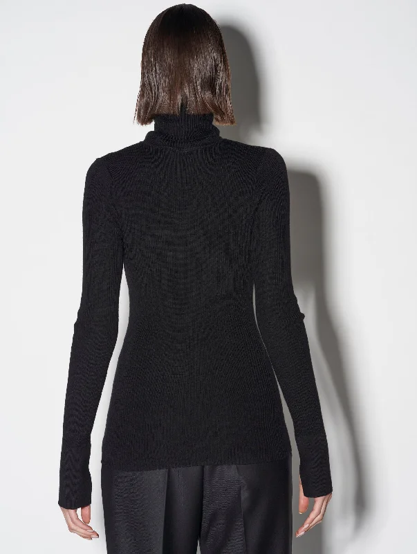 Black merino knit rollneck sweater with piercing detail